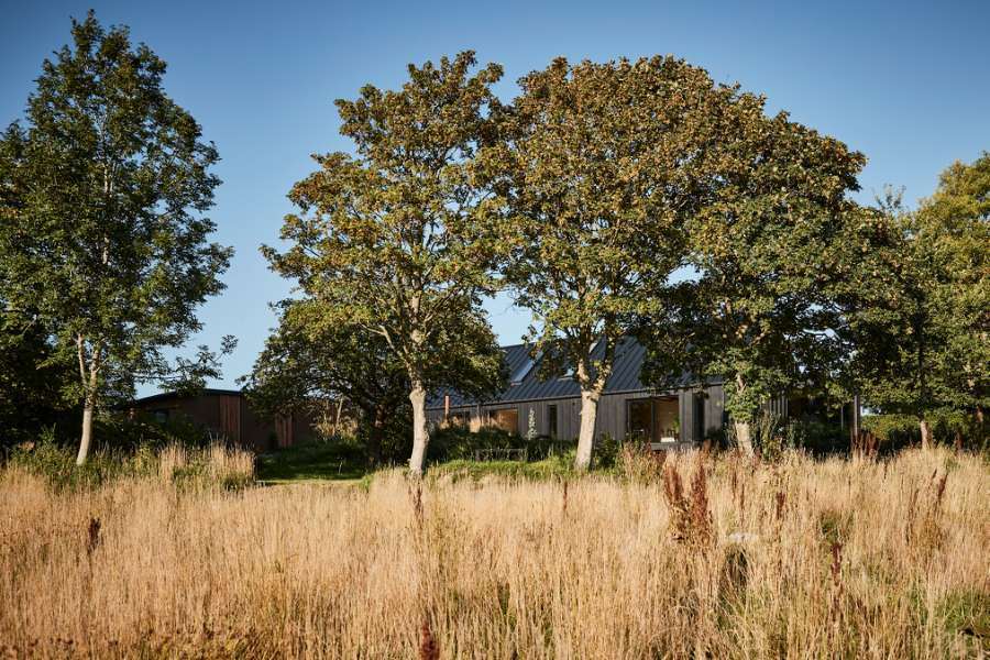“Royal” door, found in Christiania, now installed in a steel façade, Volstrupvej 63, 9240 Nibe